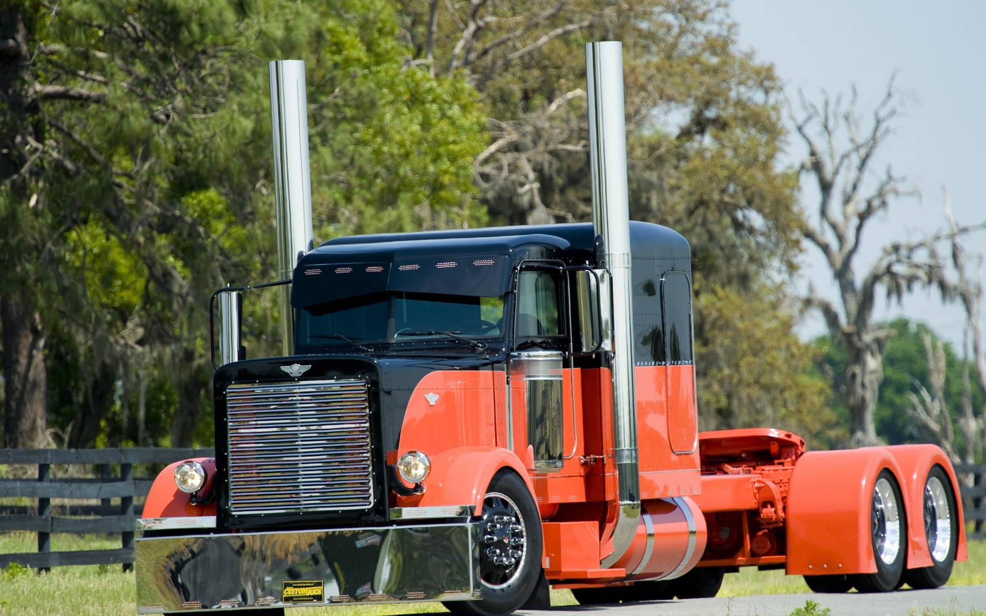 An Orange Peterbilt Truck Background