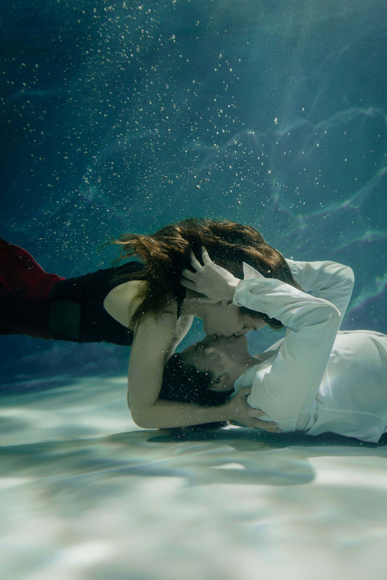 An Underwater View Of A Person Using An Iphone. Background