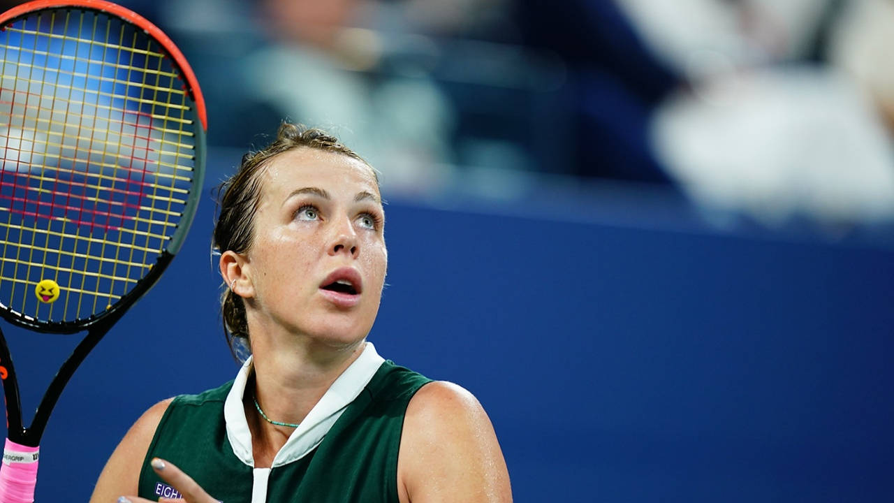 Anastasia Pavlyuchenkova Focuses On Tracking The Ball In Tennis Background