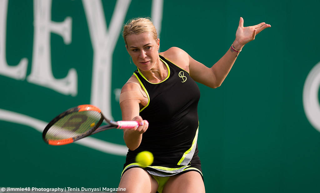 Anastasia Pavlyuchenkova In Action During A Tennis Match. Background