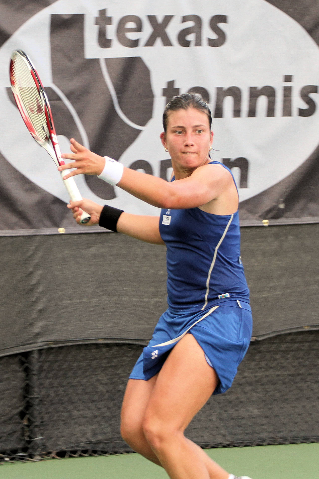 Anastasija Sevastova In Action During A Tennis Match. Background