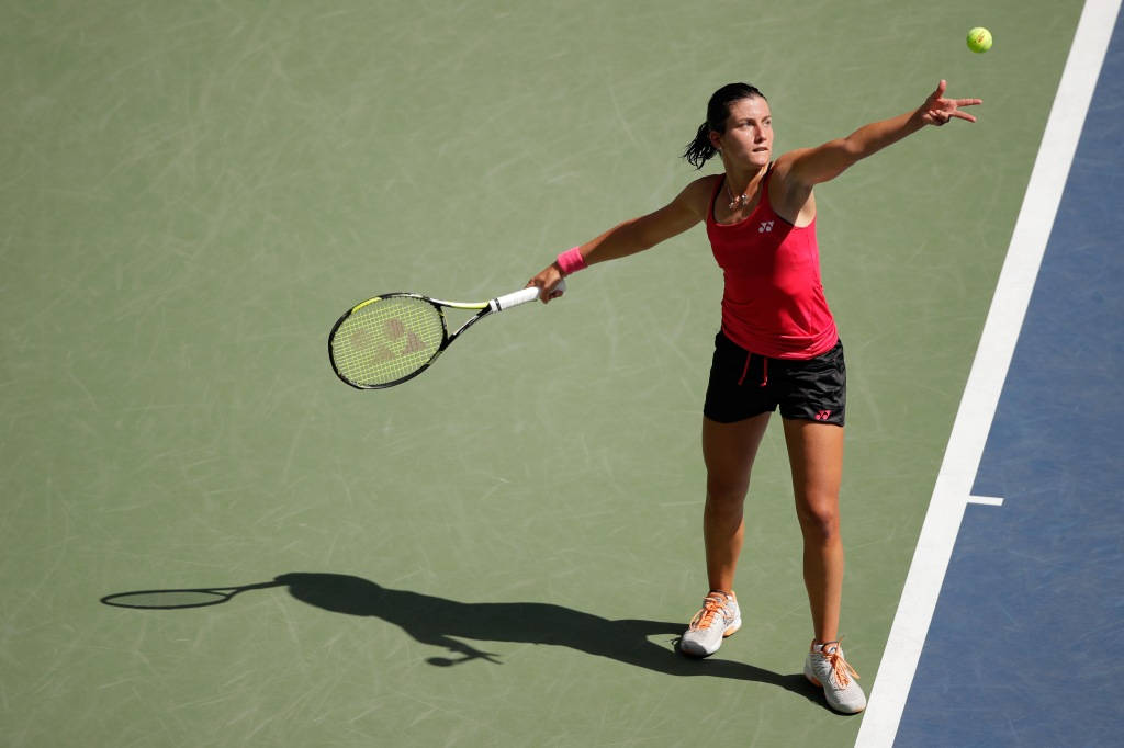 Anastasija Sevastova Preparing To Serve In Tennis Match Background