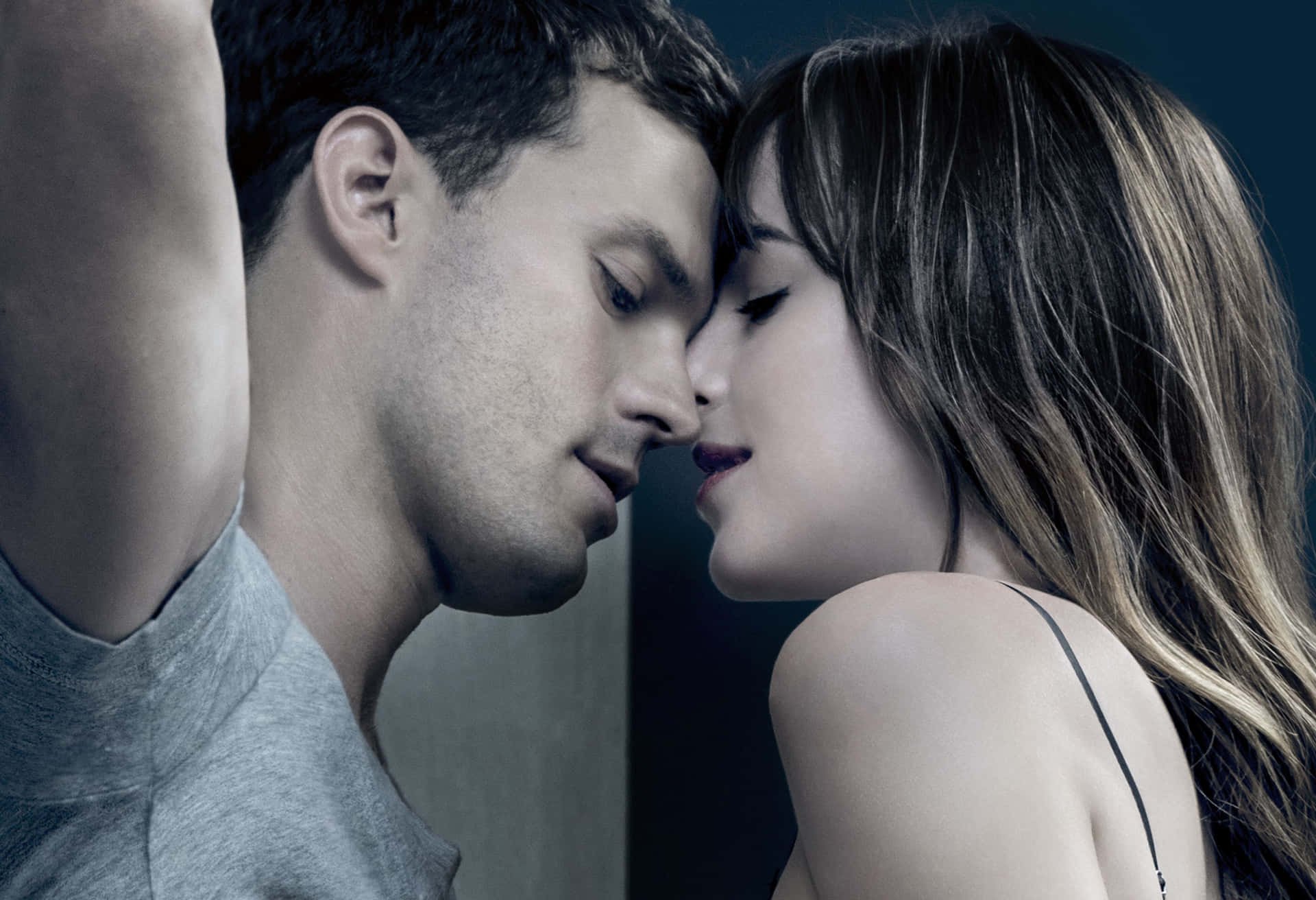 Anatasia Kissing Christian In Fifty Shades Of Grey Background
