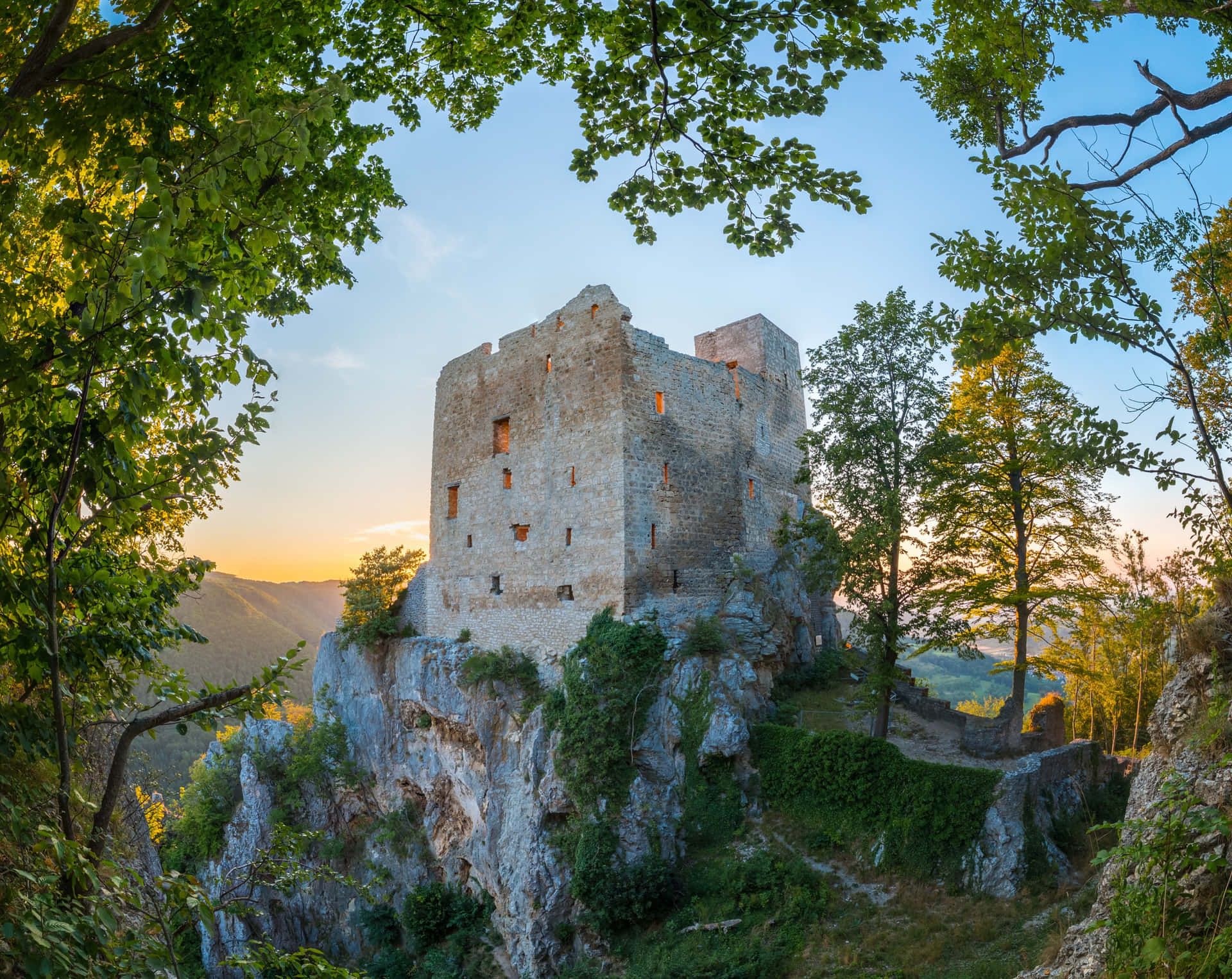 Ancient Castle Cliffside Sunset Background