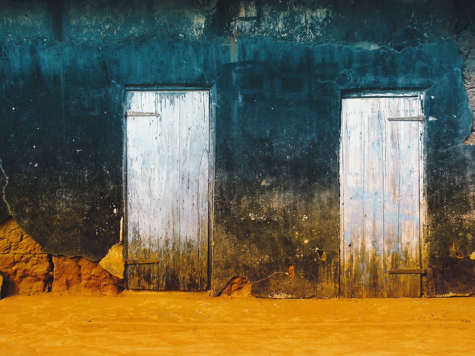 Ancient Wooden Doors In The Desert Background