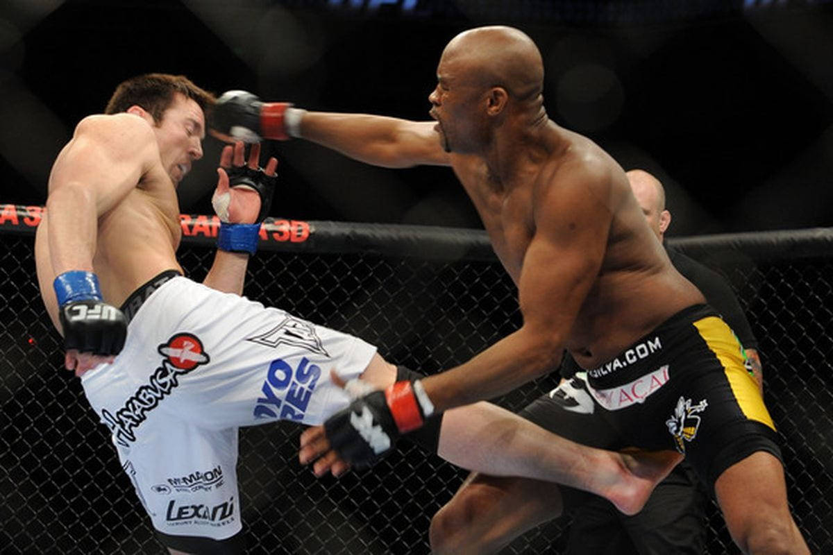 Anderson Silva Kicked By Opponent Background