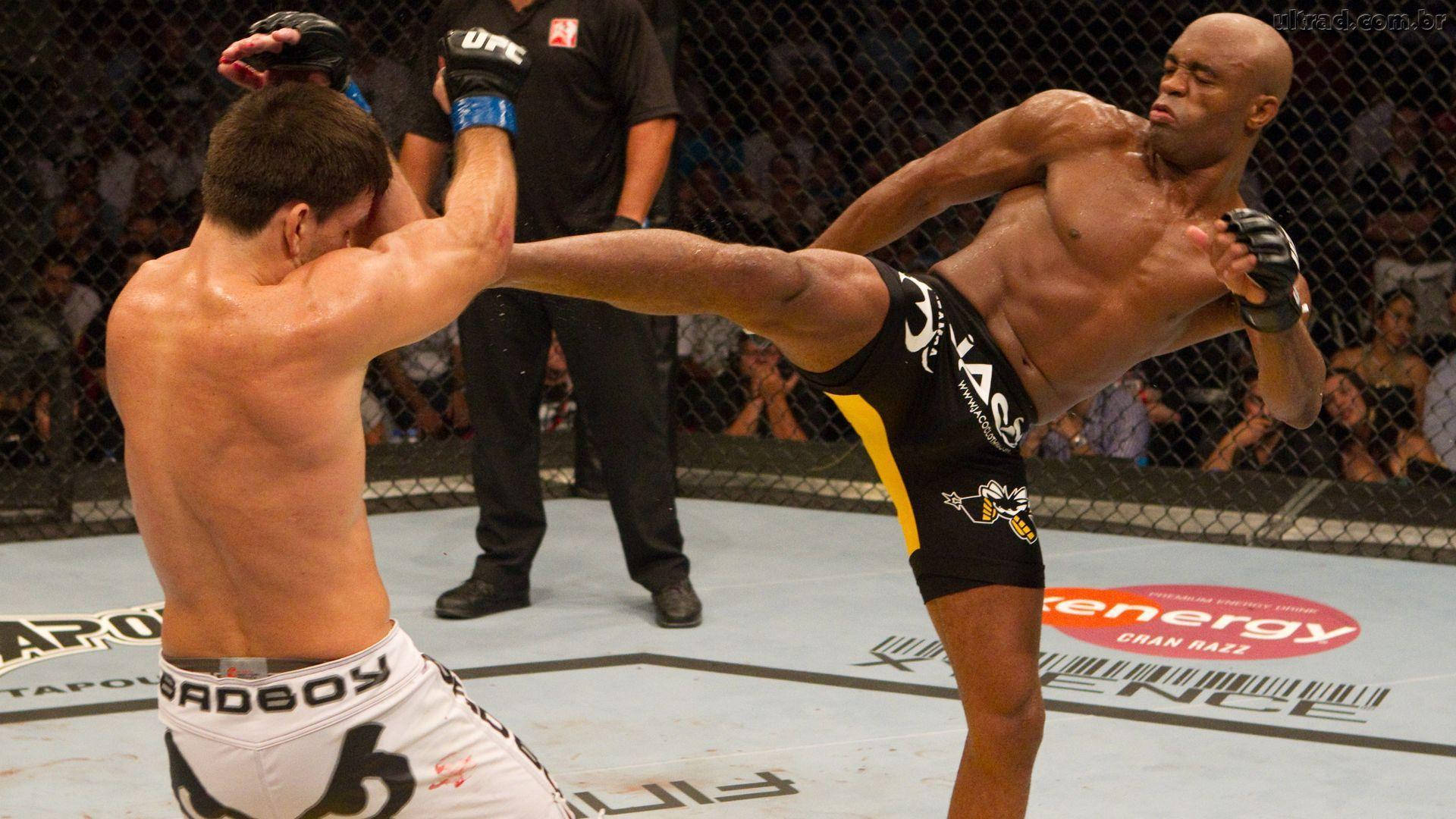 Anderson Silva Kicking Guarding Opponent Background