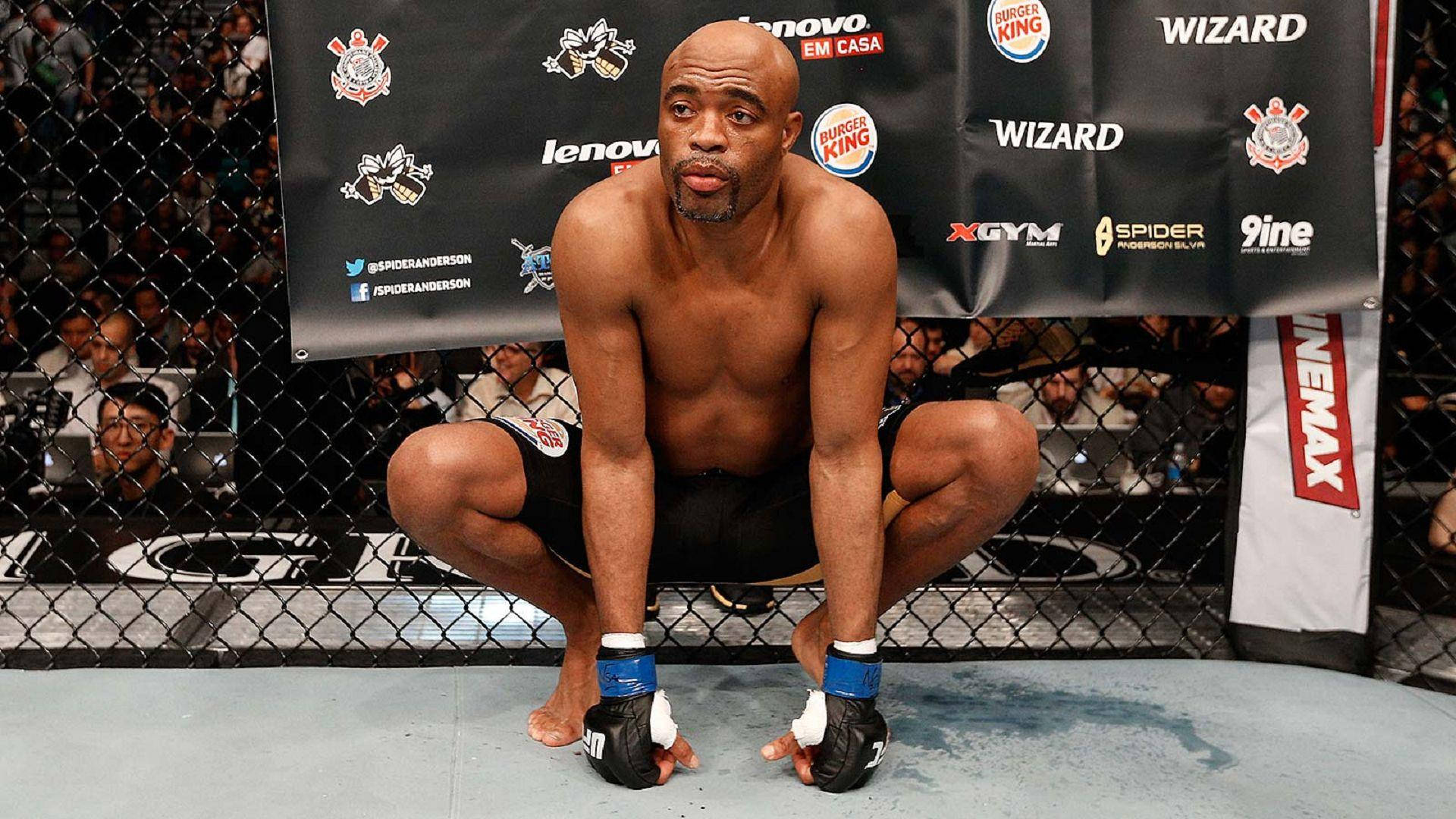 Anderson Silva Squatting Octagon Background