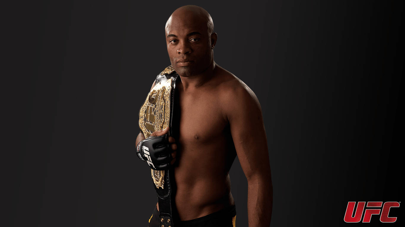 Anderson Silva, The Legendary Ufc Fighter, Holding His Championship Belt In Triumph Background