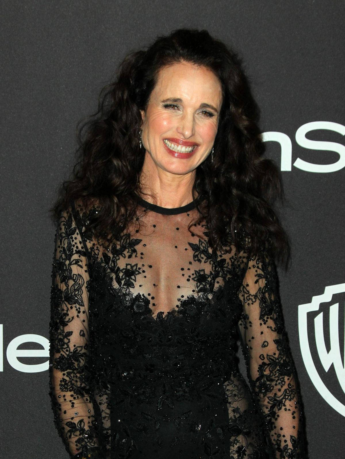 Andie Macdowell Black Lace After-party Dress Background