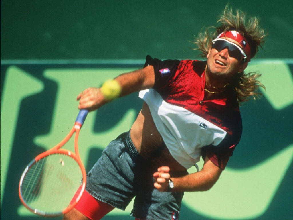 Andre Agassi Flaunting A Pair Of Black Sunglasses