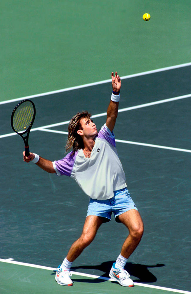 Andre Agassi Hitting Ball From Above Background