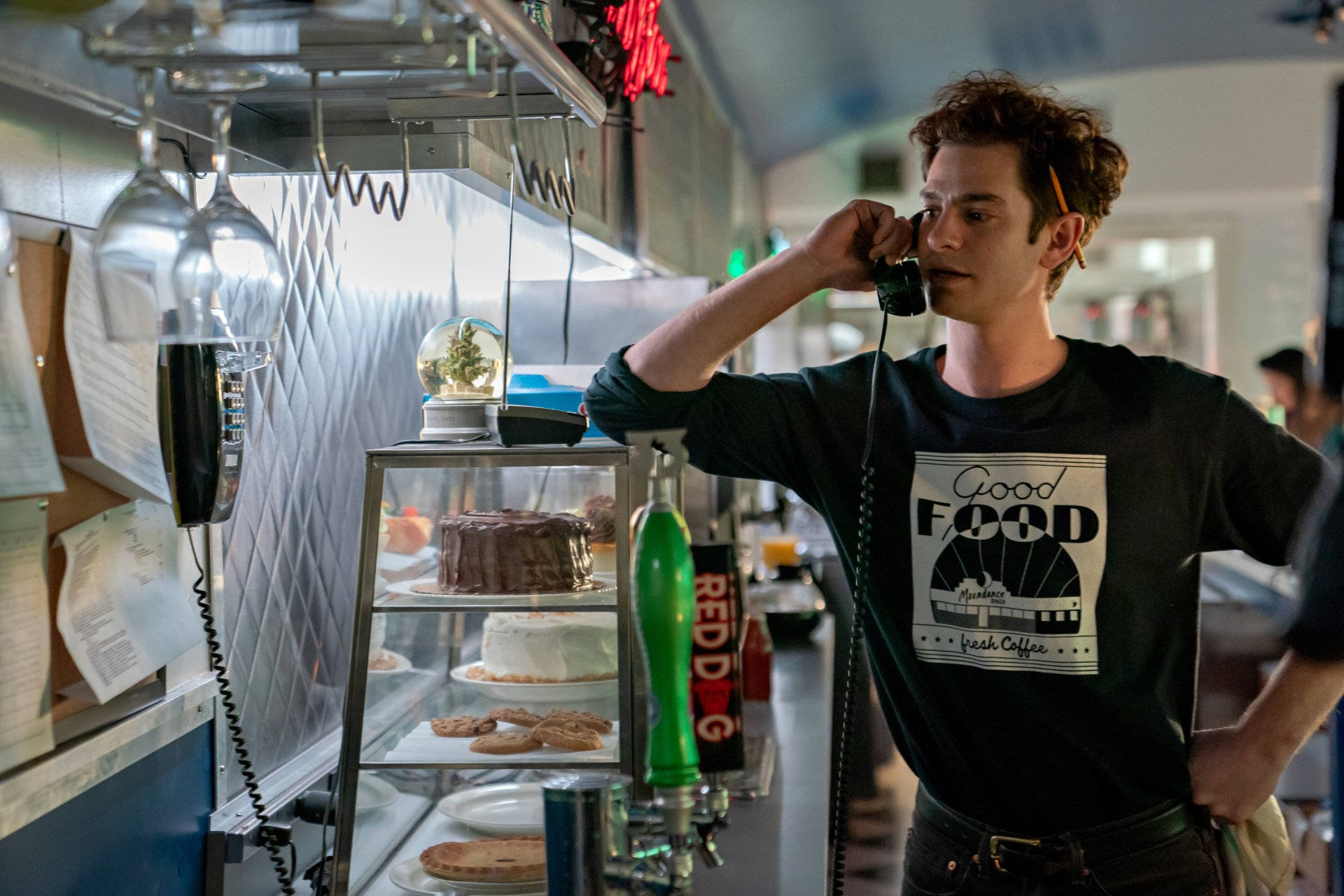 Andrew Garfield At A Diner Background
