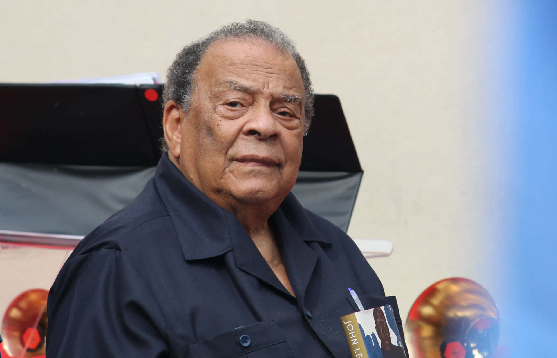 Andrew Young Holding Book Background