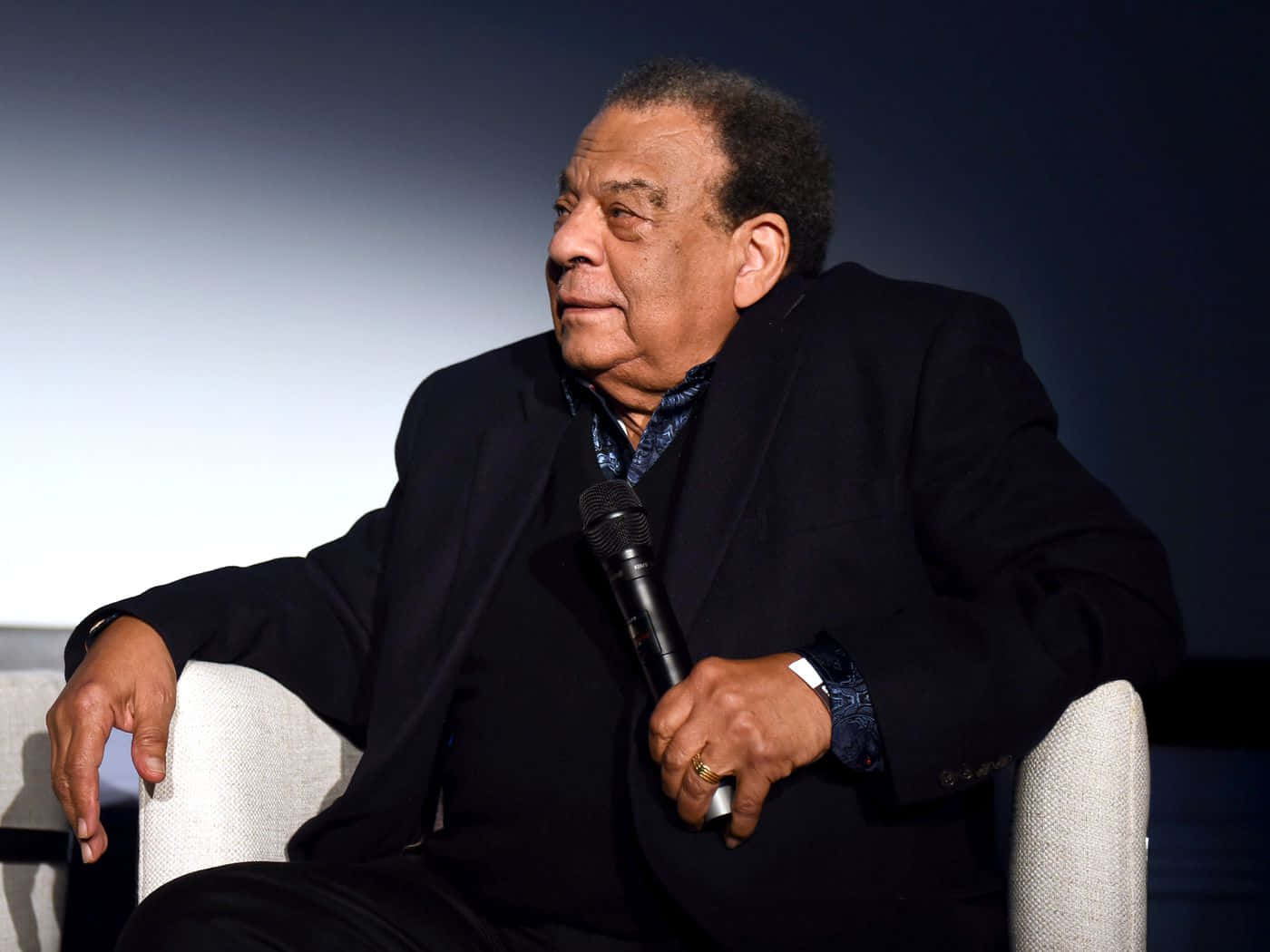 Andrew Young Holding Microphone Background
