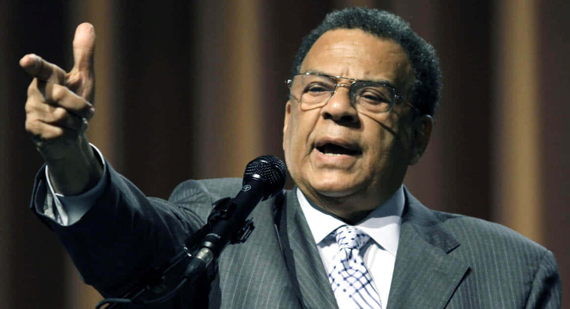 Andrew Young Pointing From Podium Background