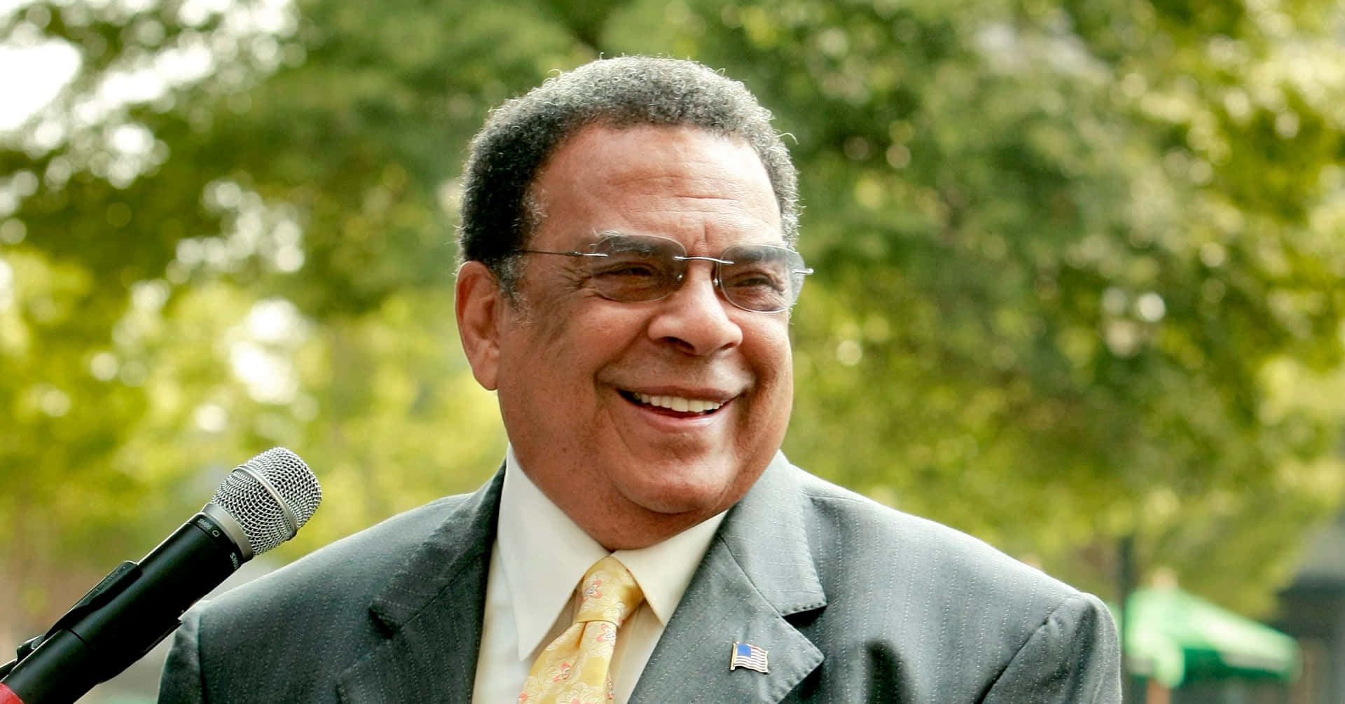 Andrew Young Smiling With Glasses Background