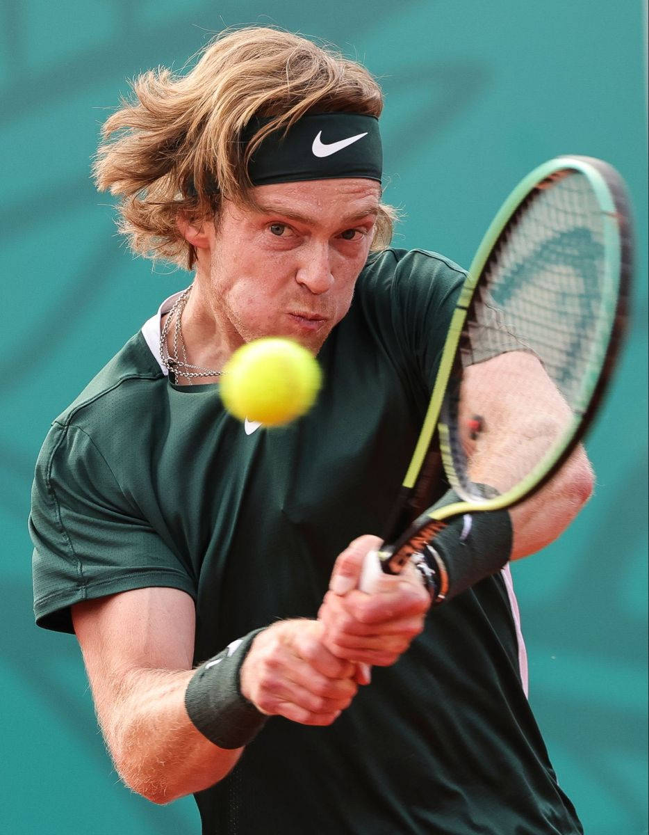 Andrey Rublev Delivering A Powerful Backhand Background