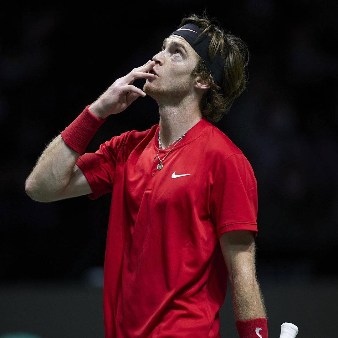 Andrey Rublev Kissing His Fingertips Background