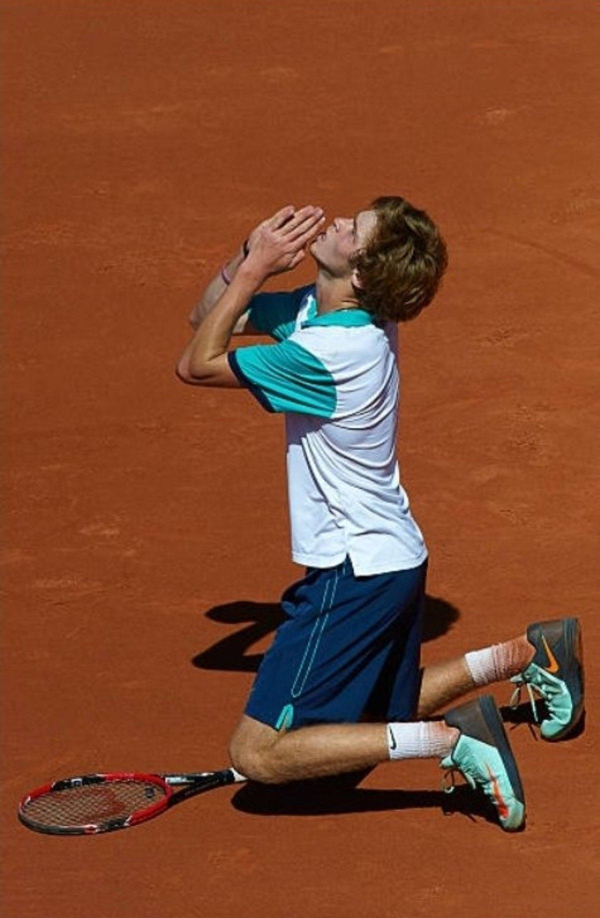 Andrey Rublev Kneeling On The Ground Background