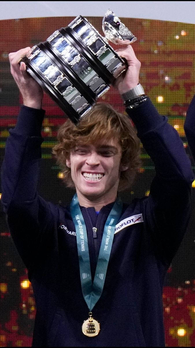 Andrey Rublev Raising His Winning Tennis Trophy Background