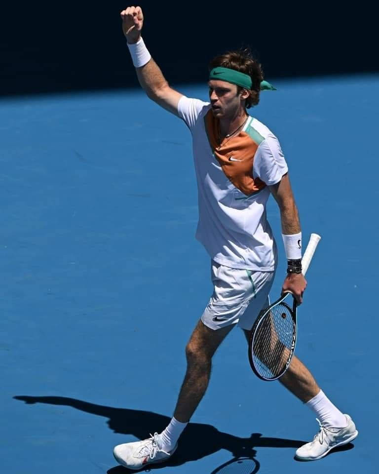 Andrey Rublev With Raised Hand Background