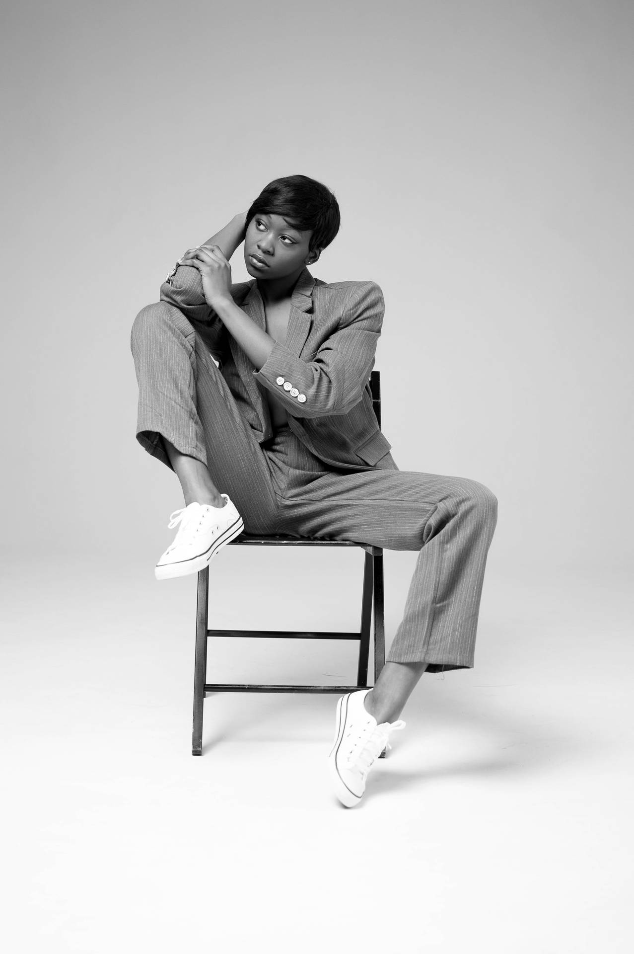 Androgynous Model On Chair Background