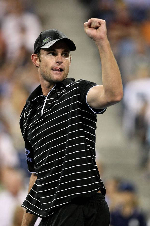 Andy Roddick Celebrating Victory With Raised Arm Background