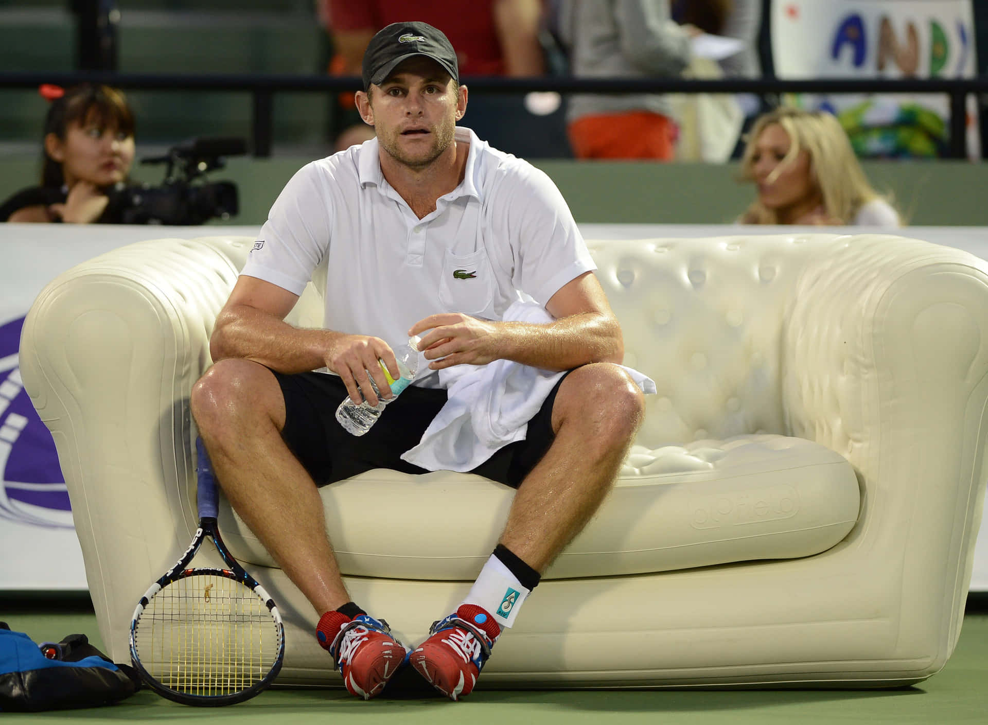 Andy Roddick Holding A Bottle Background