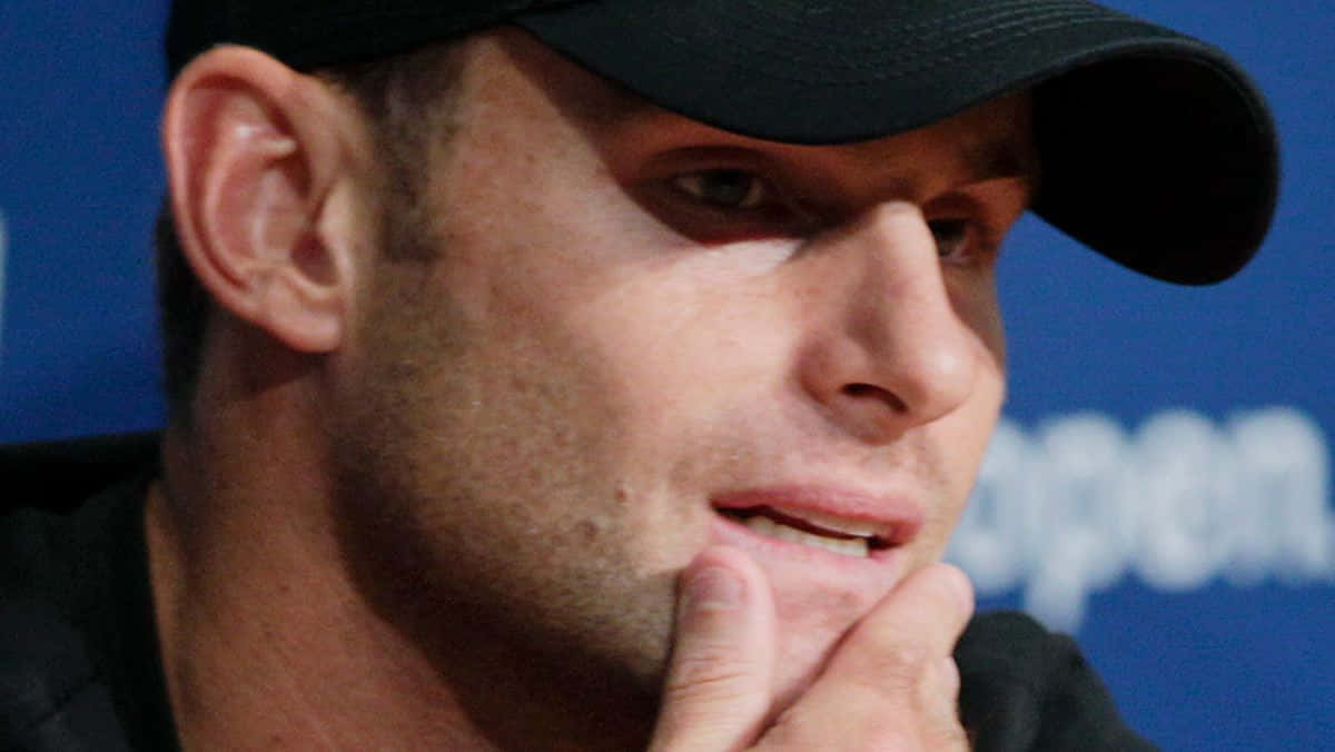 Andy Roddick Holding His Chin Background