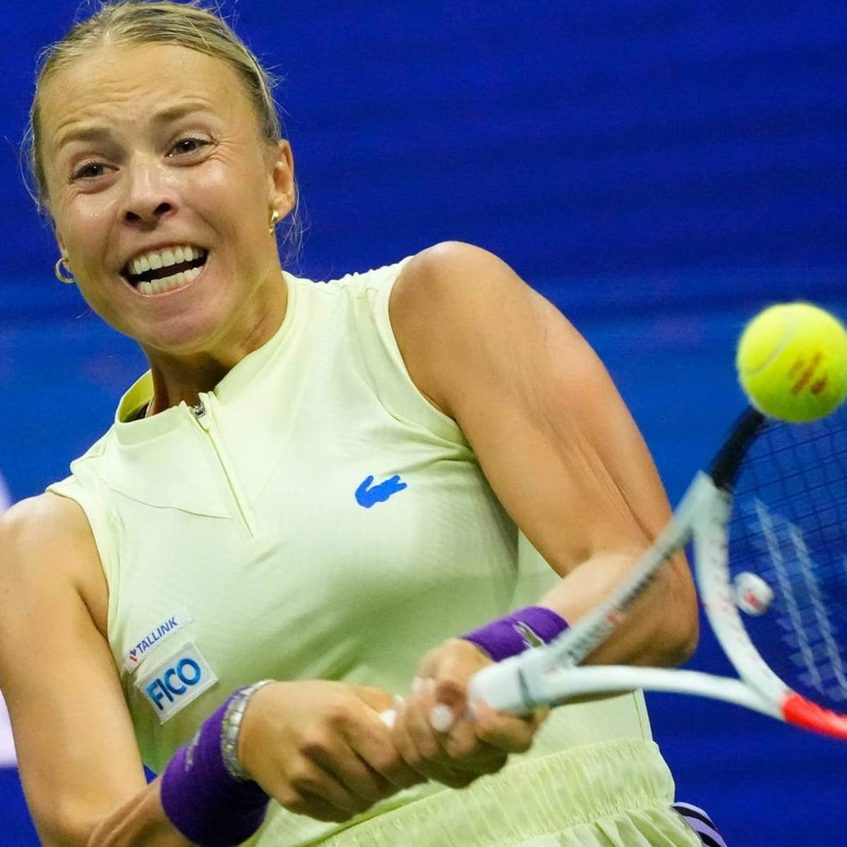 Anett Kontaveit In Action During A Tennis Match Background