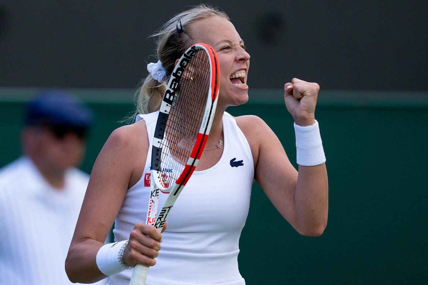 Anett Kontaveit In White Doing Cheer Background