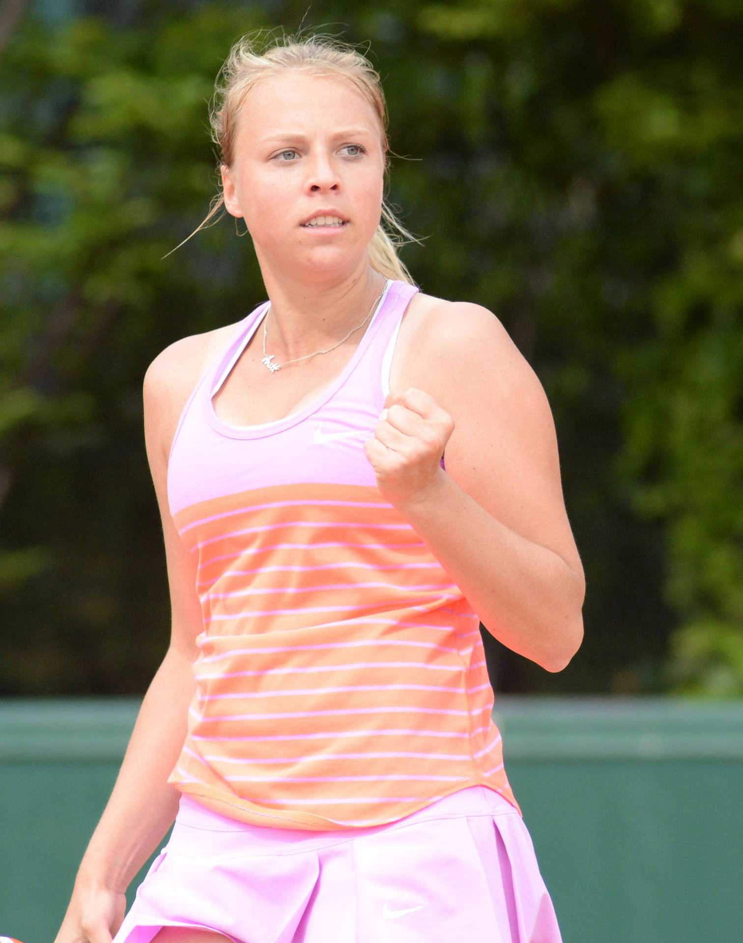 Anett Kontaveit Wearing Pink Fist Pump Background