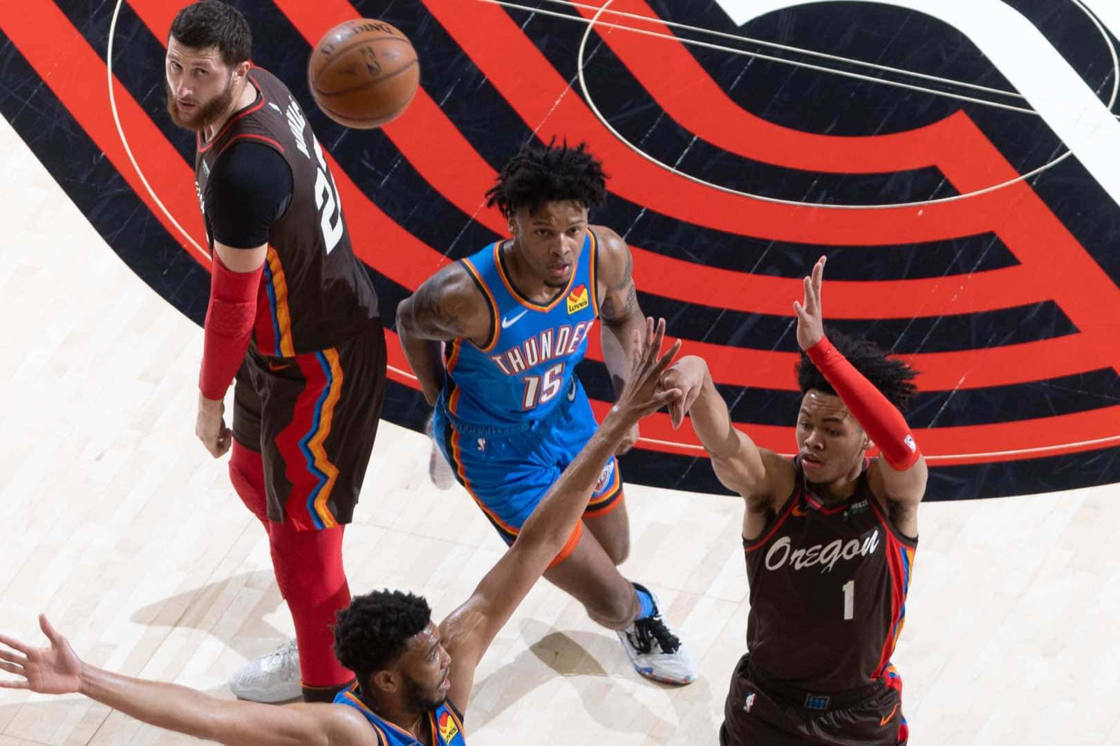 Anfernee Simons Shooting Three Against Thunders Background