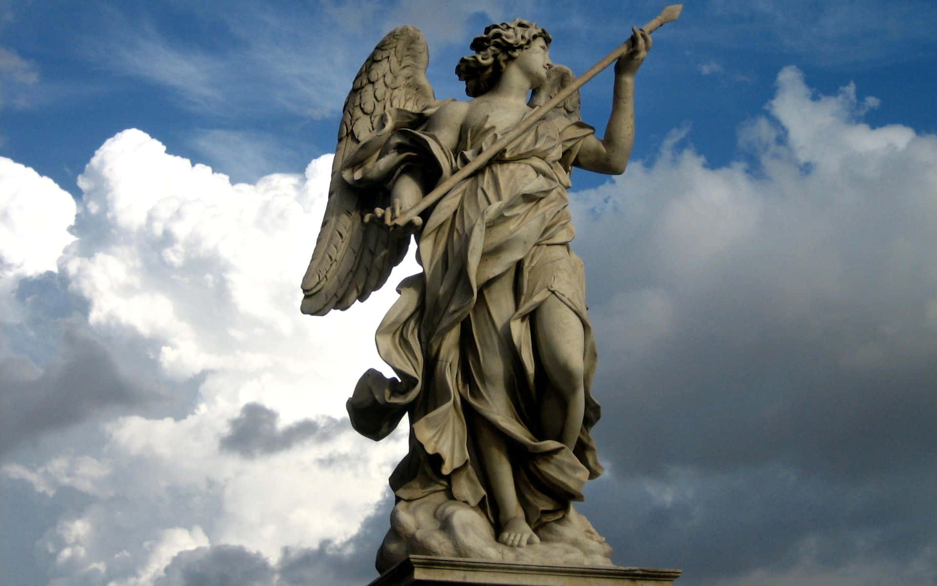 Angel_ Statue_ Against_ Cloudy_ Sky.jpg Background