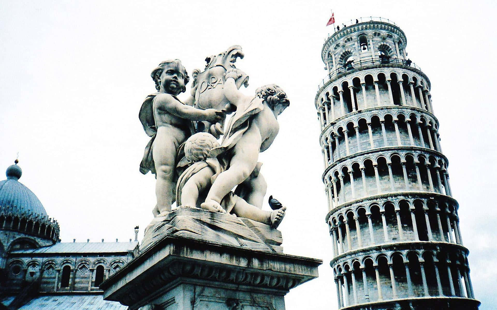 Angel Statue Near Tower Of Pisa Background