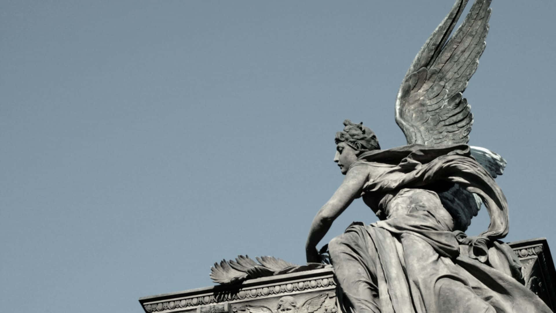 Angel Statue Profile Against Sky Background