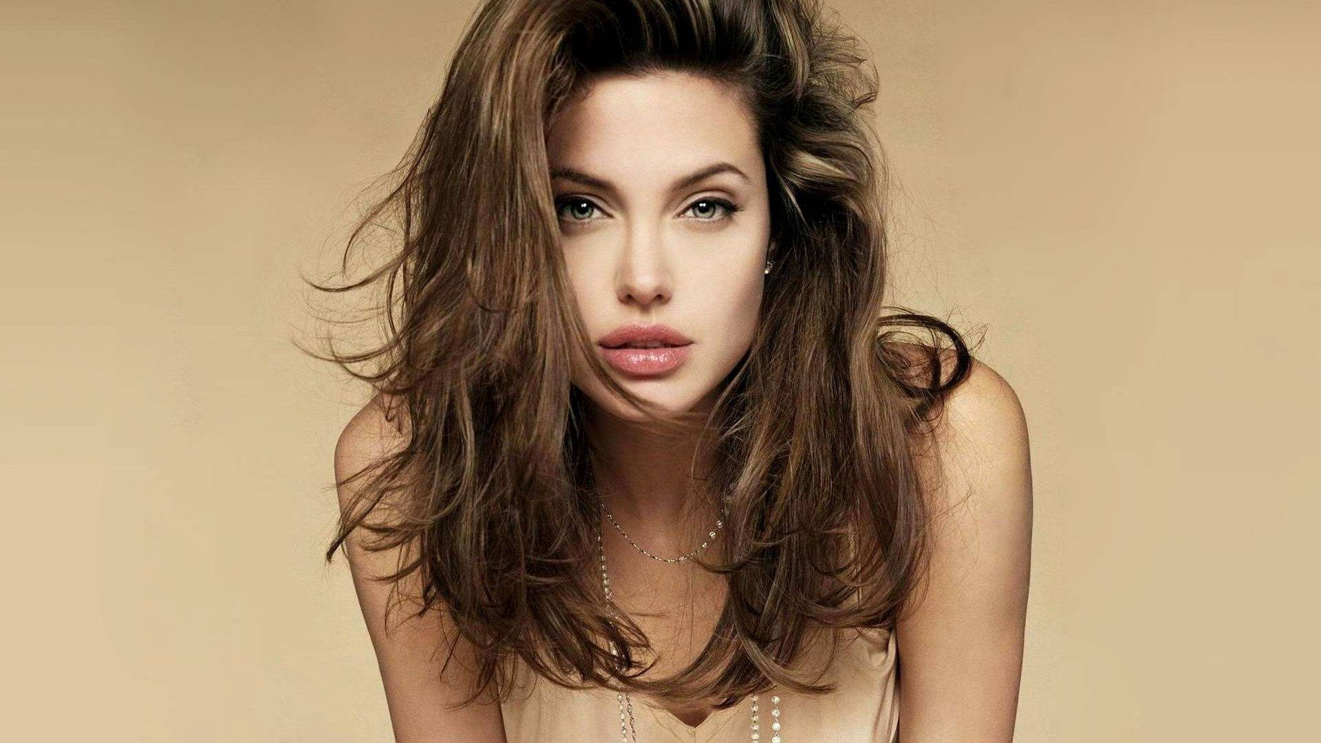 Angelina Jolie Looking Stunning In Beige Background