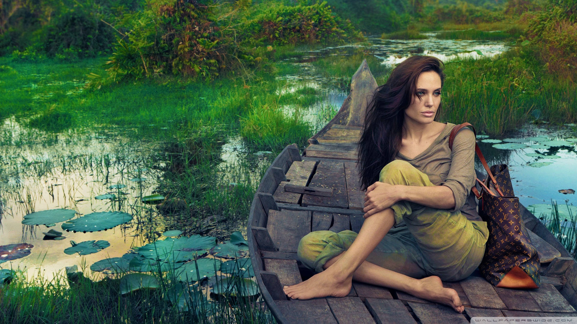 Angelina Jolie Riding A Boat Background
