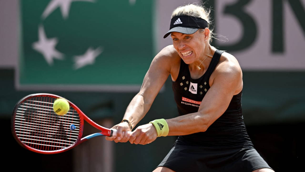 Angelique Kerber Grinning During A Match Background