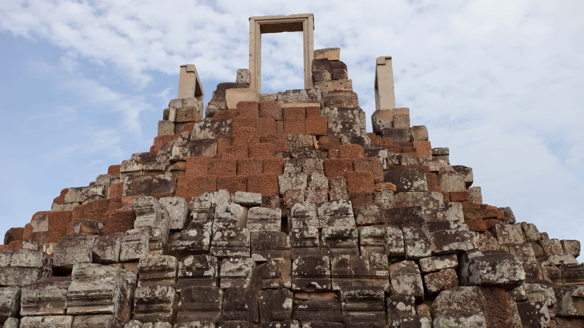 Angkor Thom Ruins Reaching Towards Sky Background