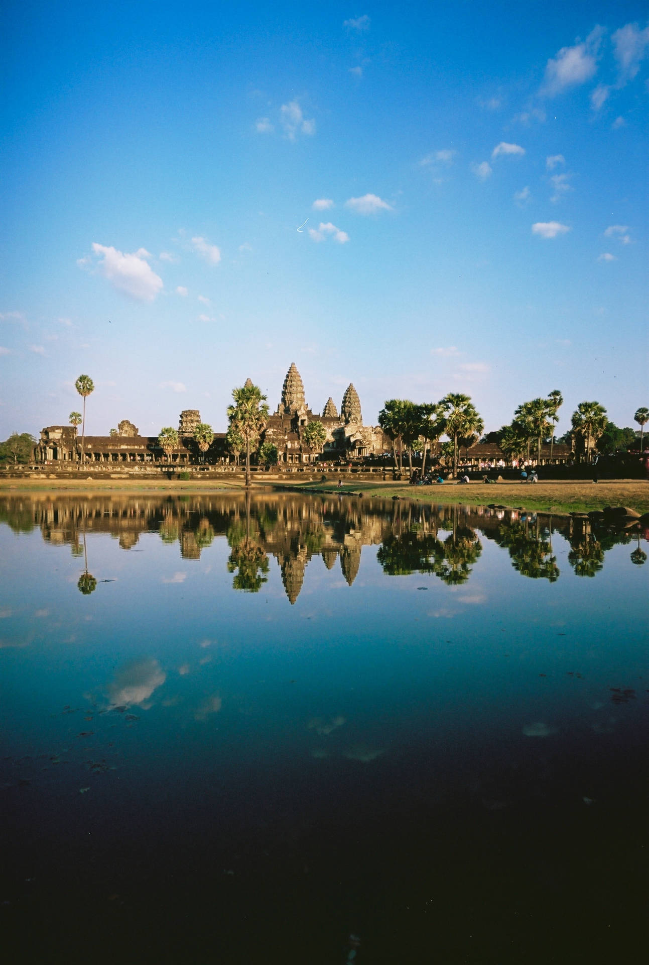 Angkor Wat Reflected In The Blue Water