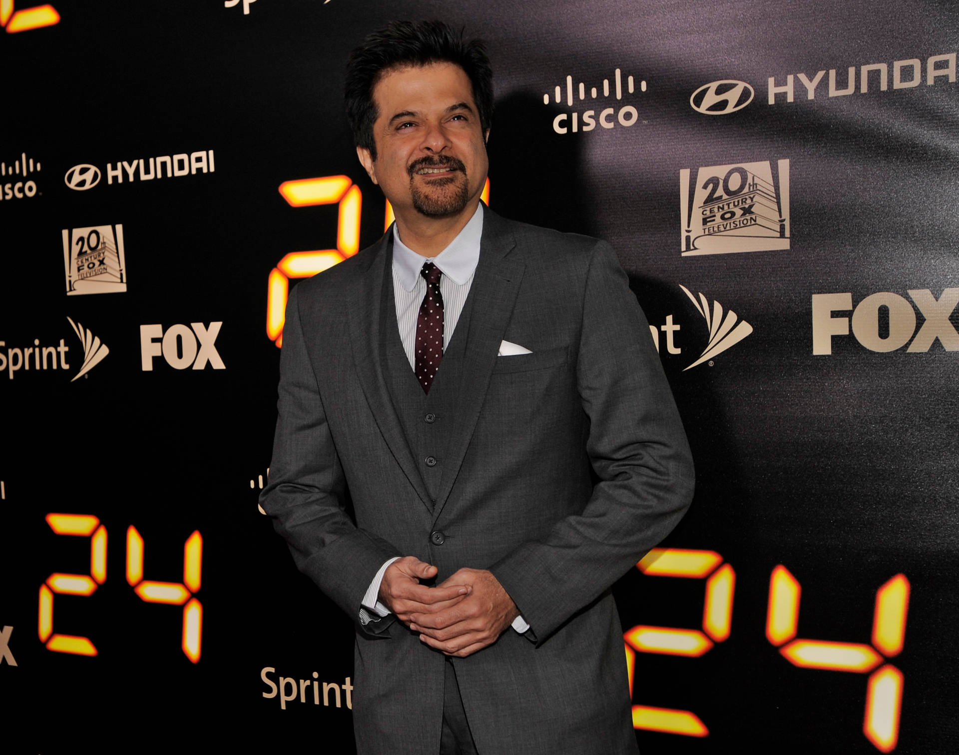 Anil Kapoor In A Grey Suit Background
