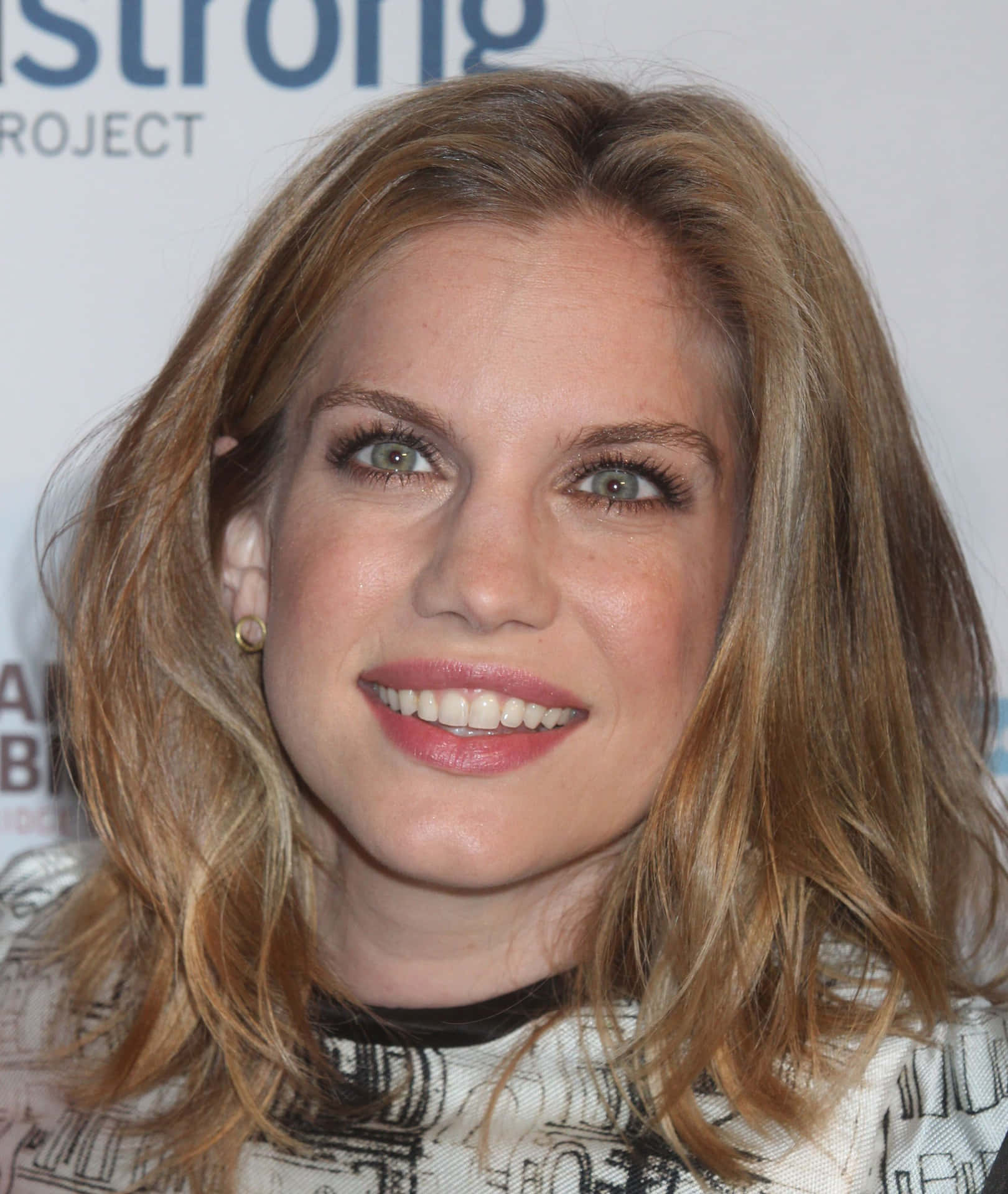 Anna Chlumsky Striking A Pose In A Photoshoot. Background