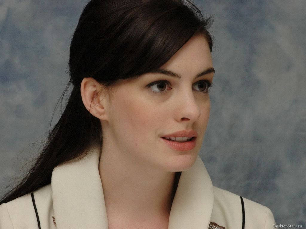 Anne Hathaway Gets Into Mischievous Grin Background