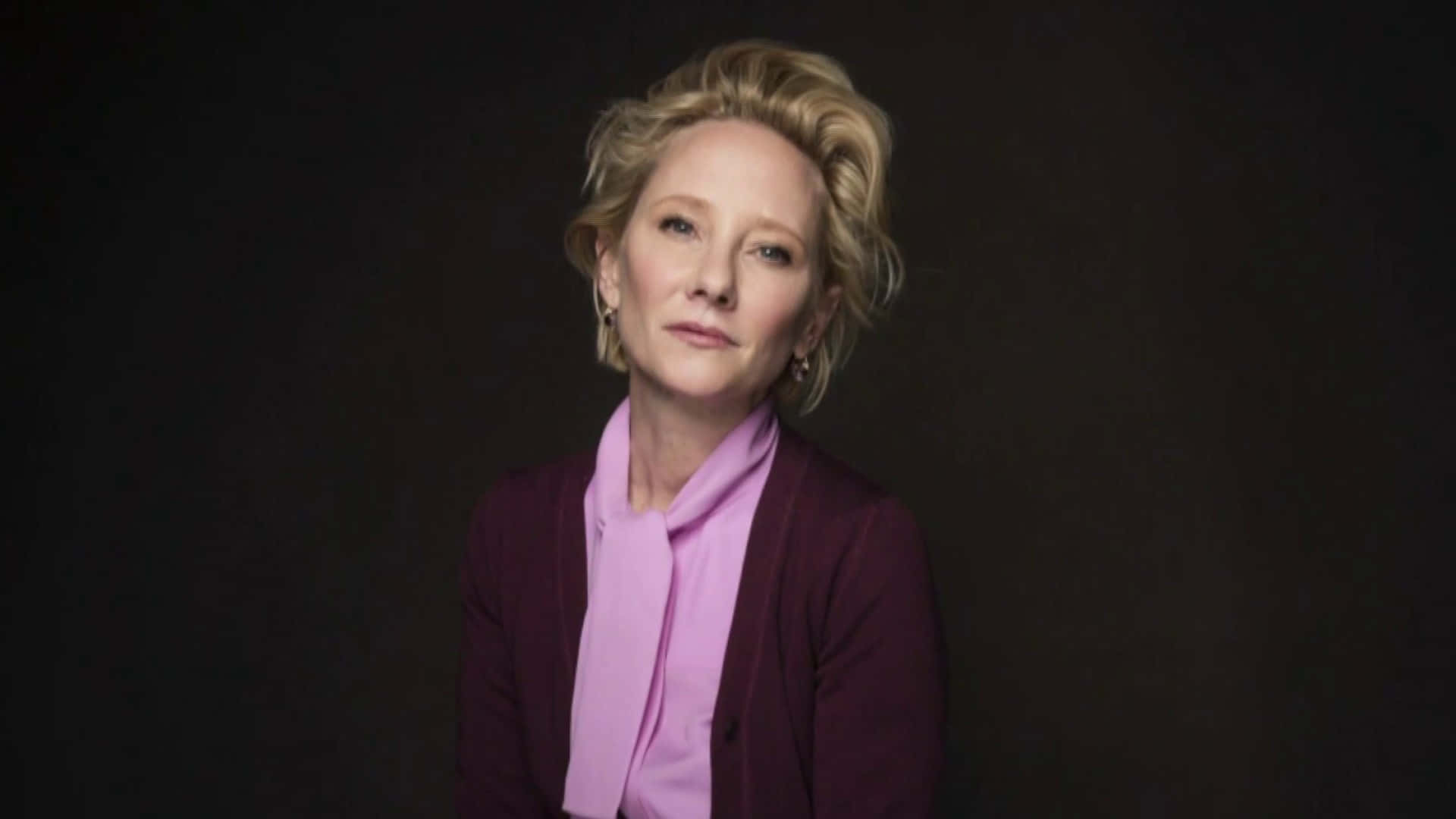 Anne Heche In Pink And Maroon Suit Background