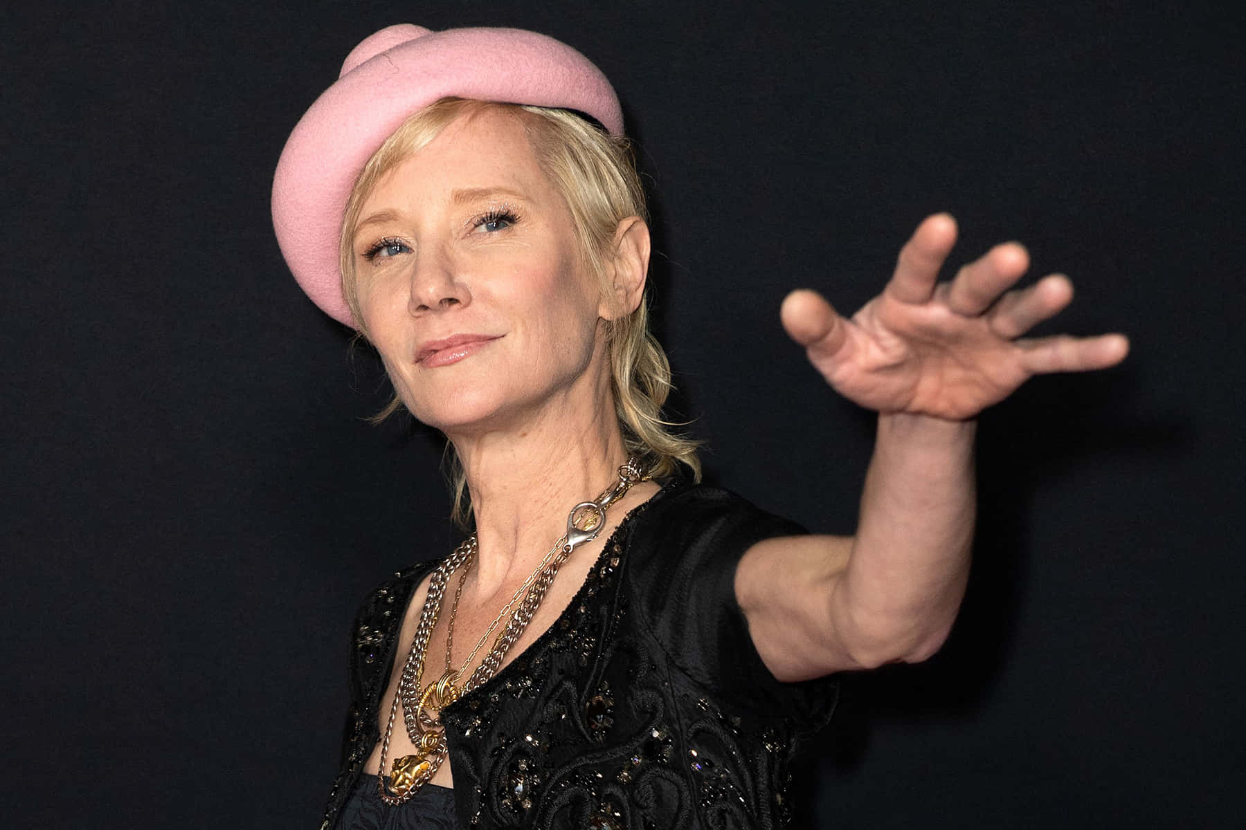 Anne Heche Wearing Pink Fedora Hat Background