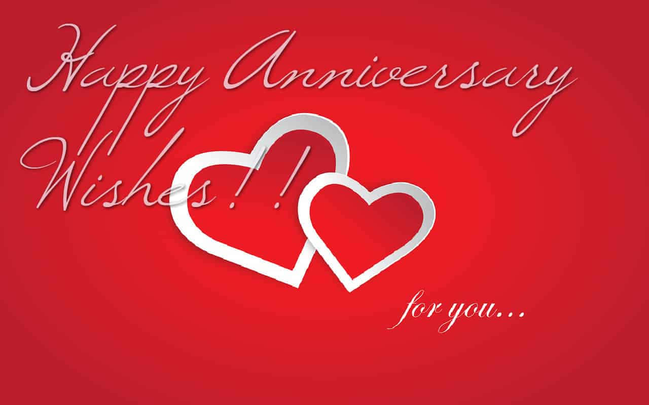 Anniversary Greetings Card With Red Hearts Background