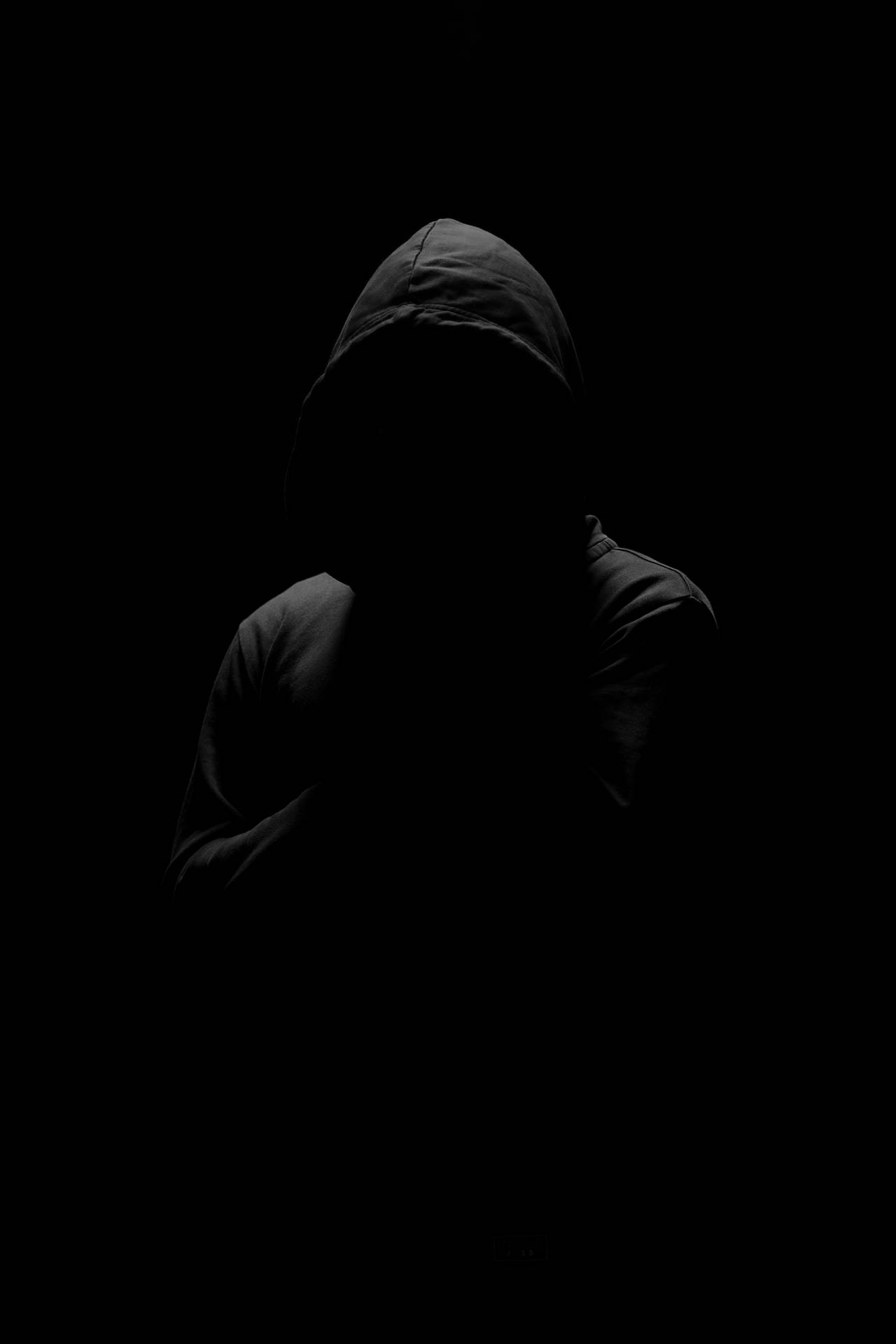 Anonymous Man In Pitch Black Background Background