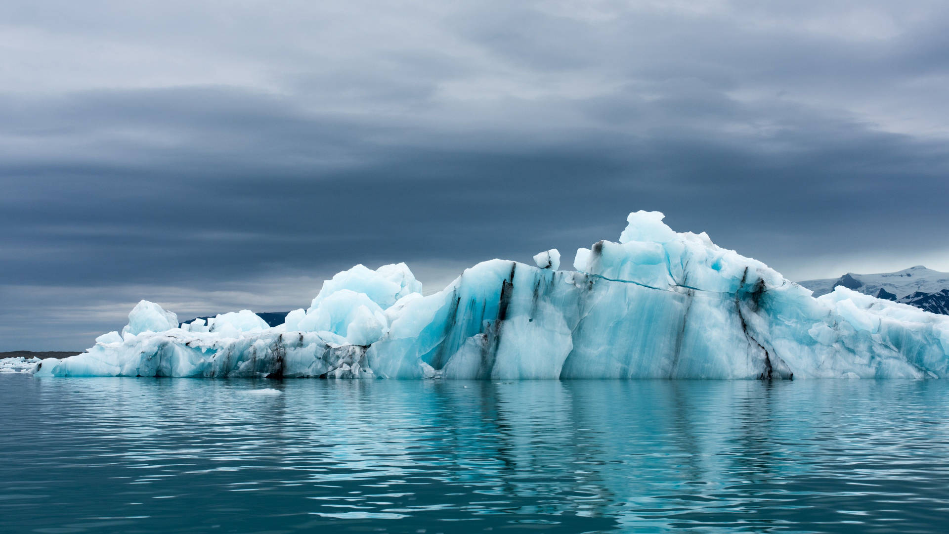 Antarctica Glacier In Frigid Water Background